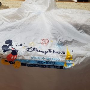 2 adult and 2 child plastic Disney rain ponchos
